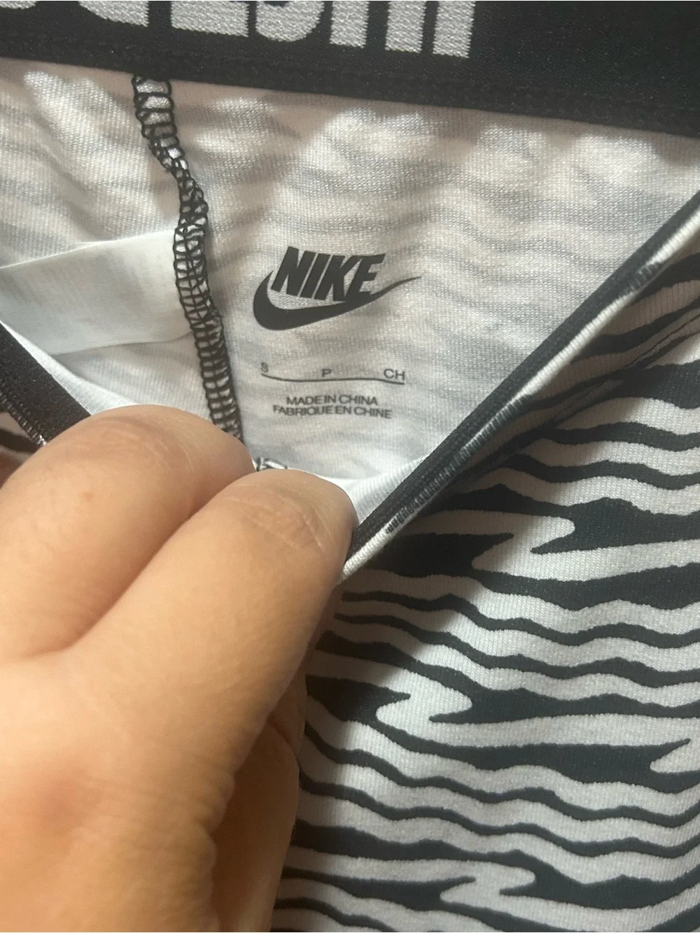 Nike Black and White Zebra Print Leggings with Orange Swoosh